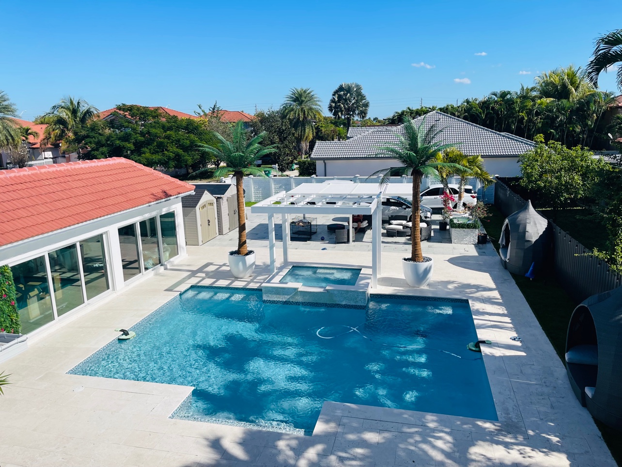 Pool and spa with white pergola